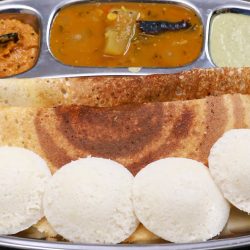 2 in 1 idli dosa batter. image shows dosa and idlis pairred with sambar and chutney