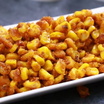 crispy corn placed in a white rectangular deep plate