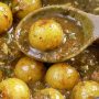 amla pickle served in a wide dish
